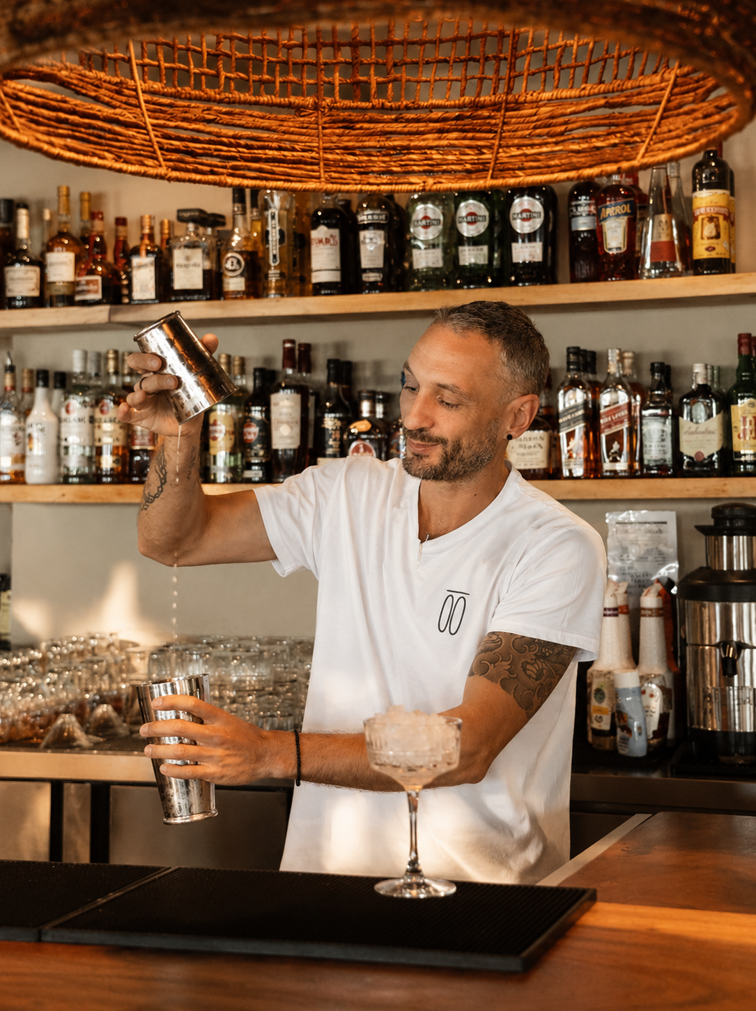 Bartender mixing a cocktail at Moosa Bay Marbella bar