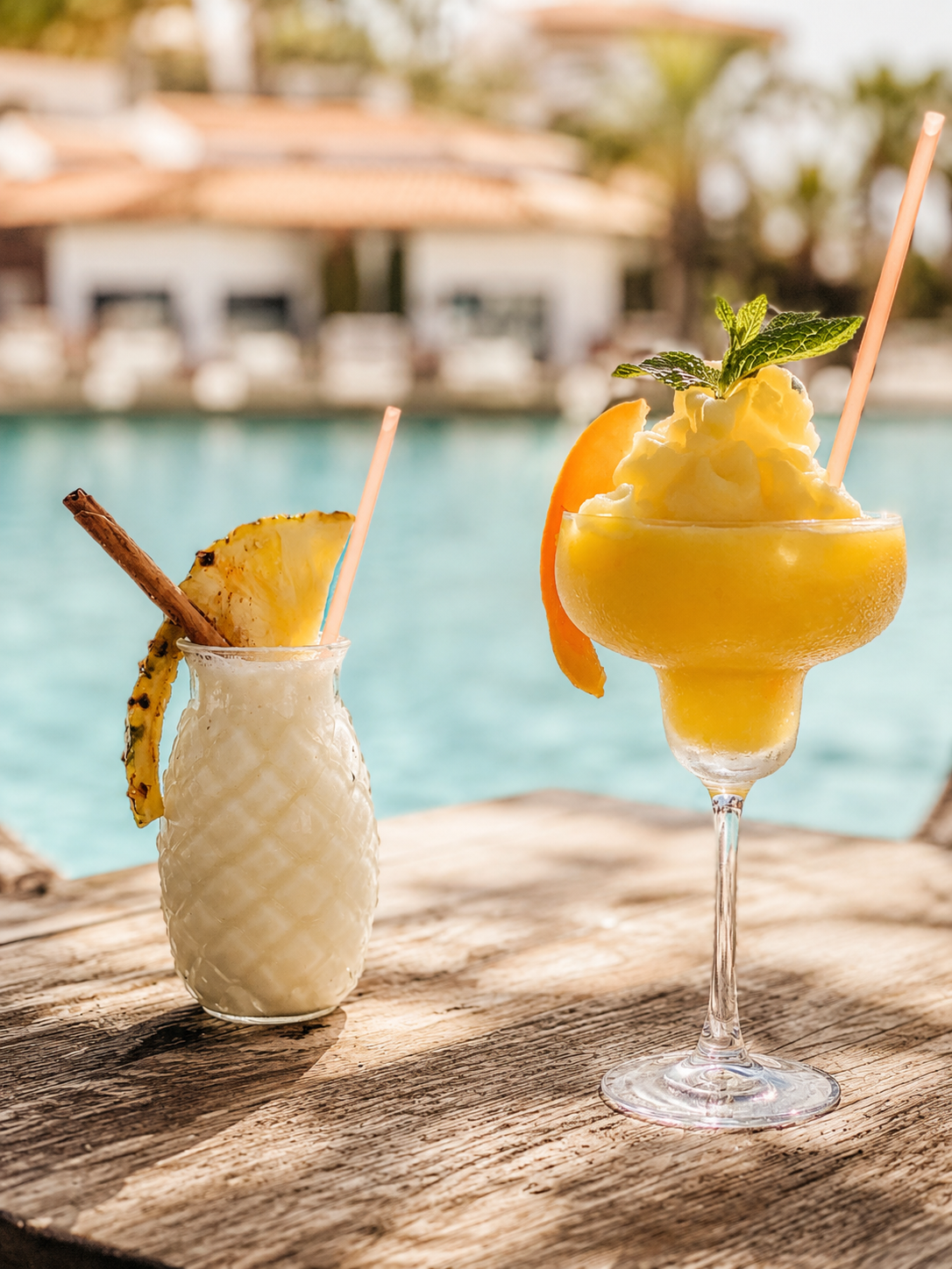 Signature frozen cocktails served at El Ancla Beach Club beside the pool