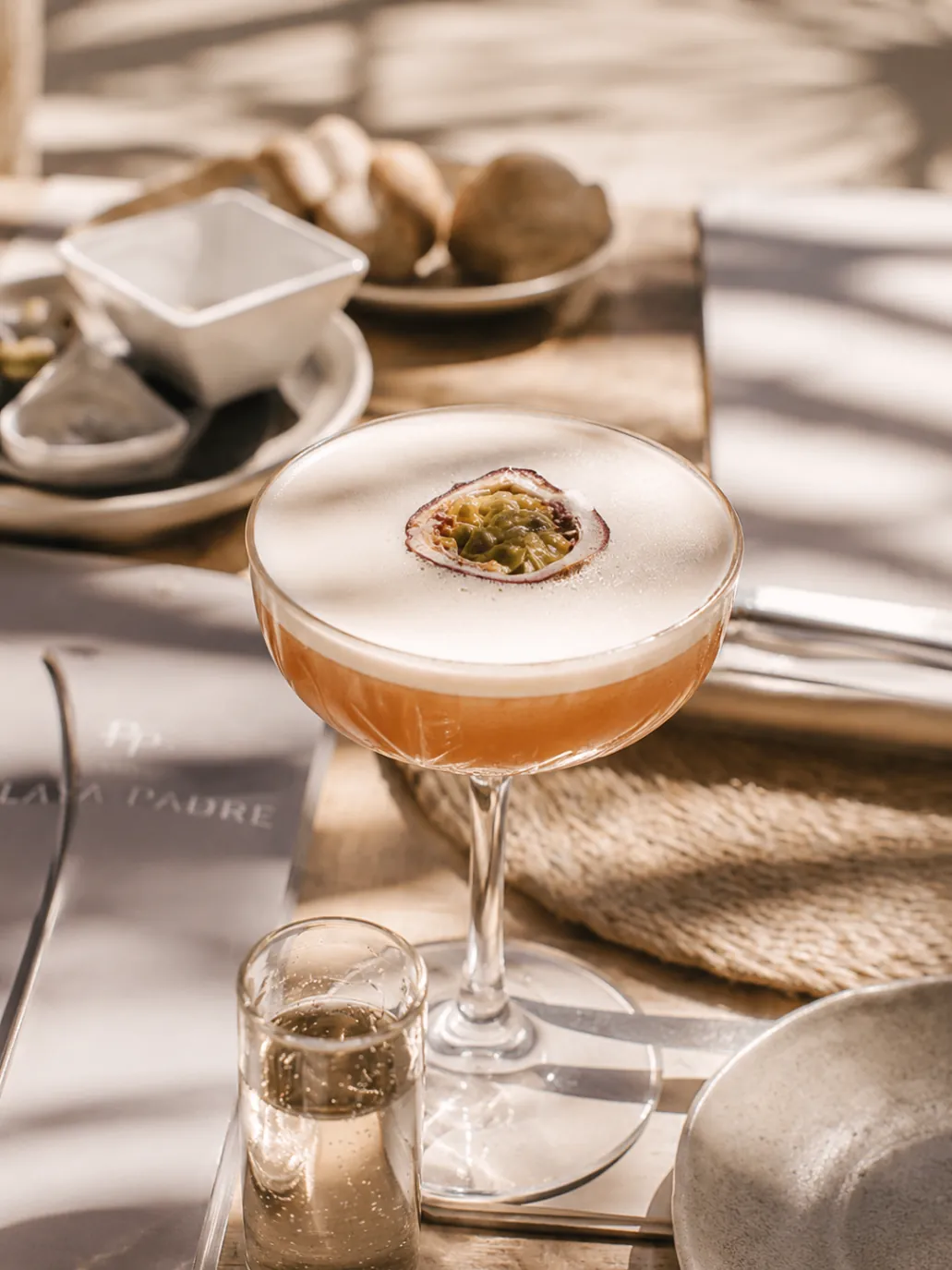 Cocktail served at Bono Beach Marbella in warm afternoon light